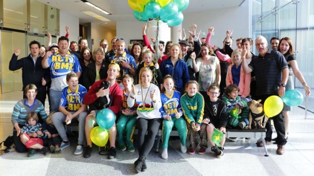 World BMX champion Caroline Buchanan returned to a welcome-home surprise at Canberra Airport on Wednesday.