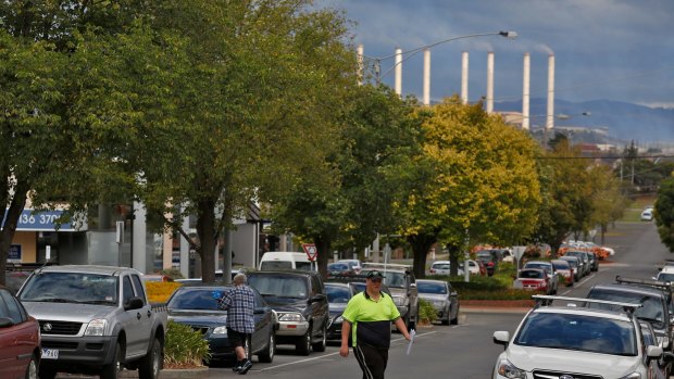 A local worker crosses the road in the Morwell town center. Photo: Eddie Jim