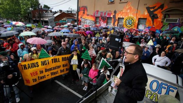 Call to arms: Greens MP Adam Bandt addresses an anti-tunnel rally in Fitzroy.