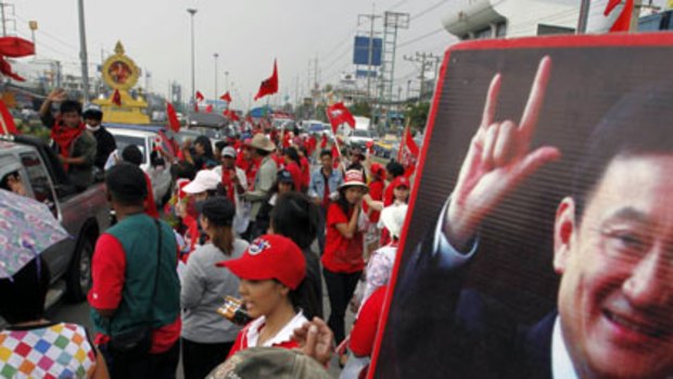 Gathering storm ... supporters of  former Thai premier Thaksin Shinawatra on a highway in Bangkok.