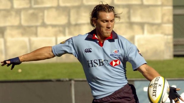 Happier days &#8230; Scenes from the Waratahs last victory over the Crusaders in 2004. Mat Rogers, above, scored 28 points in the match.