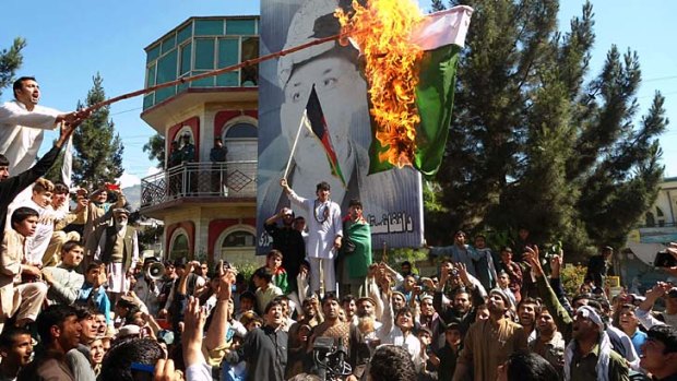Cross-border clashes flare-up: Afghan protesters burn a Pakistani flag after Kabul and Islamabad engage in a war of words over the porous frontier.