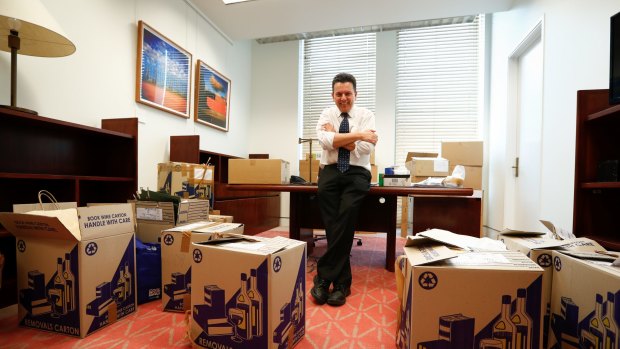 Nick Xenophon packing boxes in his office at Parliament House. 