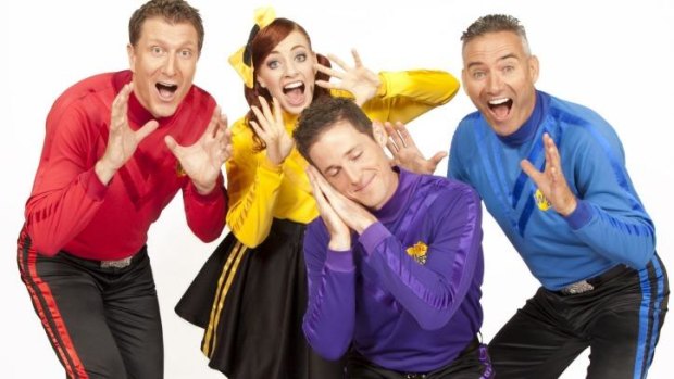 Lachlan 'Lachy' Gillespie, the purple Wiggle, and Emma Watkins, the yellow Wiggle, with Simon Pryce (in red) and Anthony Field (in blue).