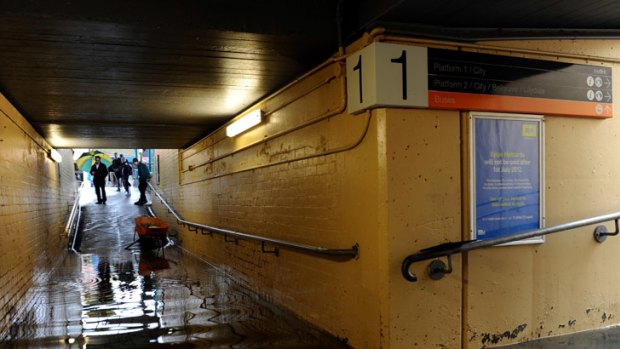 Commuters were seen removing their clothes to move between platforms via Blackburn station's flooded underpass.