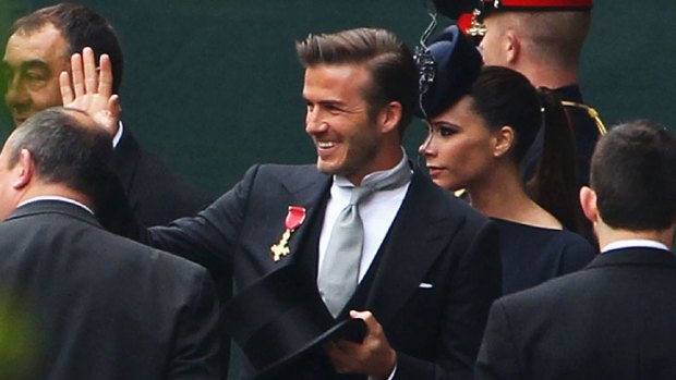 David and Victoria Beckham arrive.