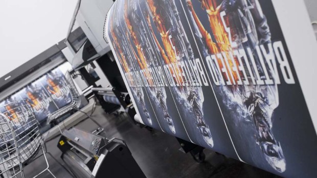 Battlefield 3 graphics roll off the printers at the Walls 360 Las Vegas headquarters.