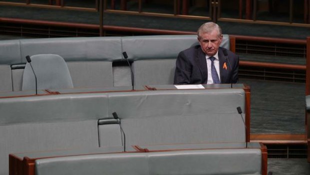 Labor MP Simon Crean sits on the backbench during question time.