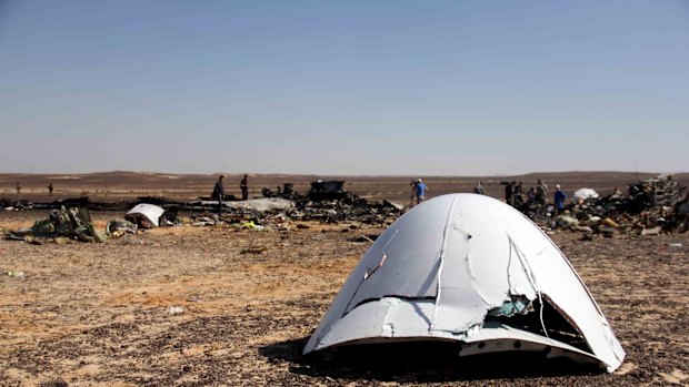 Debris of a Russian airplane is seen at the site a day after the passenger jet bound for St. Petersburg, Russia, crashed in Hassana, Egypt,