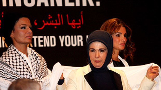 Press for peace: Qatar's Sheikha Mozah (left), Turkey's Emine Erdogan (centre) and Jordan's Queen Rania join the wives of other Middle Eastern and Asian leaders in Istanbul.