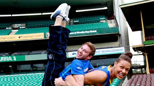Call for equality ... champion diver Matthew Mitcham is lifted by basketballer Liz Cambage at the SCG yesterday.