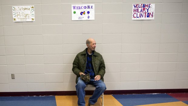 A voter waits for Hillary Clinton to arrive at a campaign event at the Keokuk Middle School, Iowa, on Thursday.