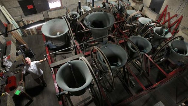 Striking: Gordon Cannon rings the bells at St Mary's Cathedral.