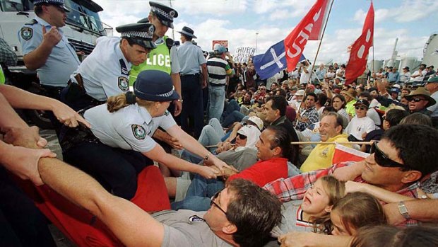 Watershed &#8230; a sacked worker is removed from outside Patrick Stevedores' Port Botany terminal in April 1998.