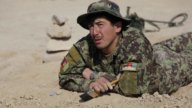 SSG Ali Mohammad Abdul Qawi, an Afghan National Army soldier from 4th Battalion, 205th Hero Corps learns to search and clear improvised explosive devices.