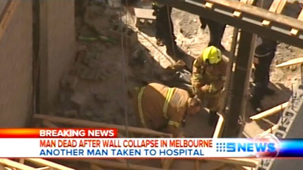 Emergency services workers at the scene of the wall collapse in Caulfield.