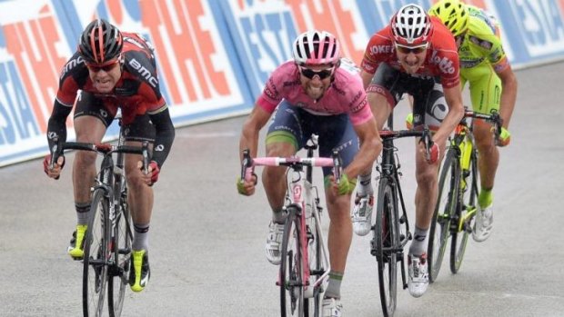 Michael Matthews, second left, approaches the finish line to win the sixth stage of the Giro d'Italia, from Sassano to Montecassino. Cadel Evans is on the left.
