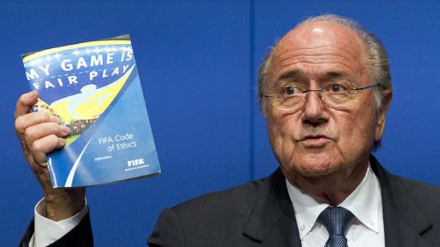 FIFA president Sepp Blatter vigorously defends football's governing body at press conference overnight.