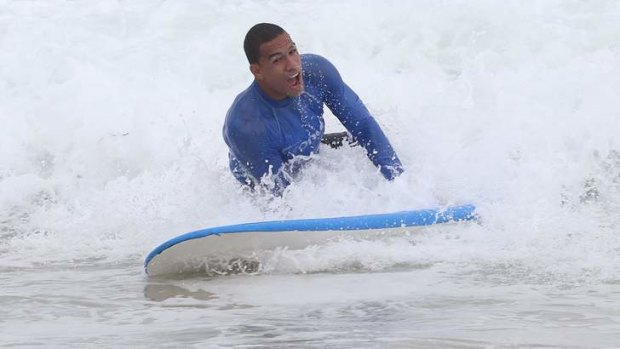 Will Hopoate hits the surf at North Cronulla.