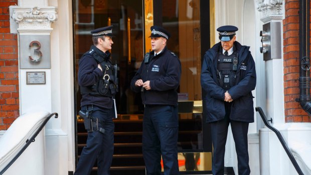 Metropolitan Police officers stand guard outside the Ecuadorian embassy in London, where Julian Assange is holed up.