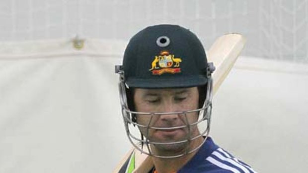 Ricky Ponting tests his fractured finger in the nets.