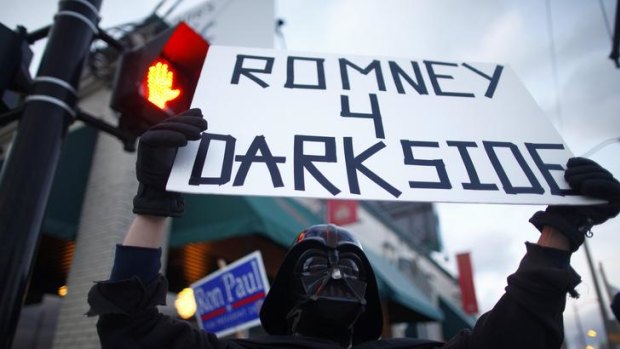 Supporters of Republican candidate Ron Paul in New Hampshire show their distaste for rival Mitt Romney.