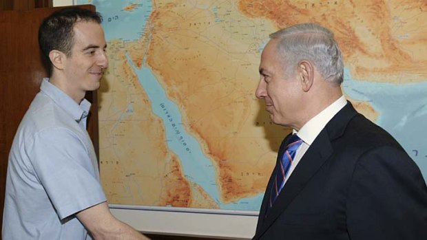 Back home ... Ilan Grapel, left, is greeted by Israel's Prime Minister Benjamin Netanyahu.