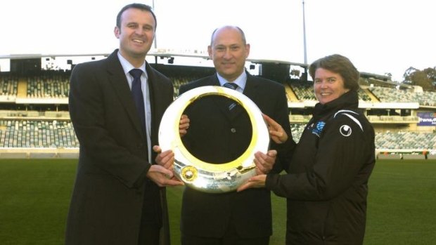 Andrew Barr, Ivan Slavich and Heather Reid with the A-League trophy in 2007. Reid says it will realistically cost upwards of $8 million a season to run an A-League team.