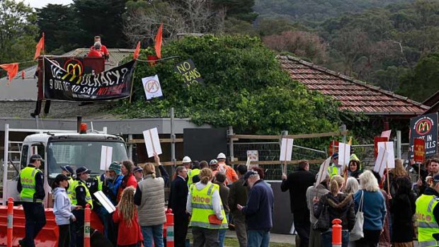 Local residents in Tecoma protest against a McDonald's restaurant being built in the area.