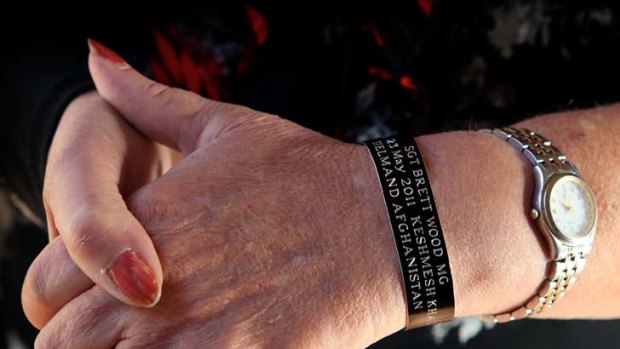 "Remember mum, I'm doing what I love" ... Alison Jones wears a wristband commemorating her son Sergeant Brett Wood, who was killed in Afghanistan last year.