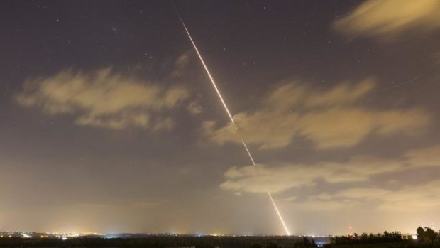 A rocket streaks towards Israel after being launched from the Gaza Strip. 