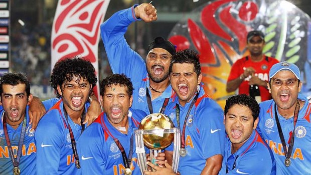 India's players celebrate with the trophy.