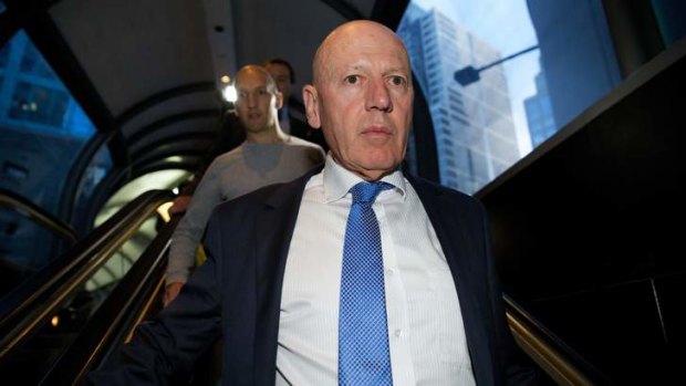 Verbal battle: Chris Hartcher departs the ICAC on Monday, followed by his son.