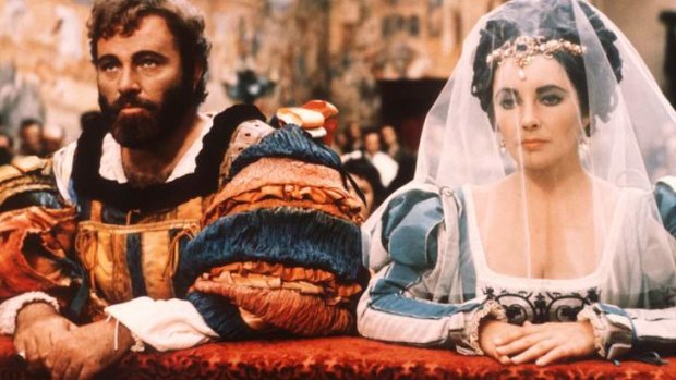 Actors Elizabeth Taylor and Richard Burton kneel in a scene from the film <i>The Taming of the Shrew</i>, 1973.