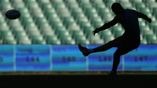 Kicking practice: Kurtley Beale puts boot to ball at training during the week.