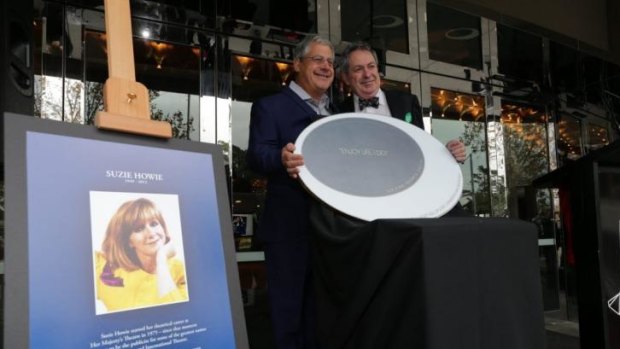 Sir Cameron Mackintosh and Paul Taylor unveil a plaque on the Arts Centre Melbourne walk in honour of Taylor's late wife Suzie Howie.