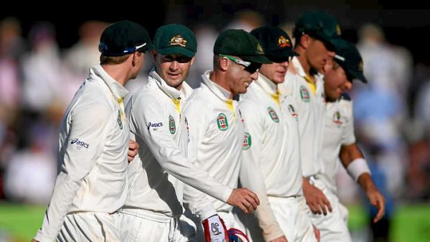 A conga line of failure: Michael Clarke leads the Australian team from the field.