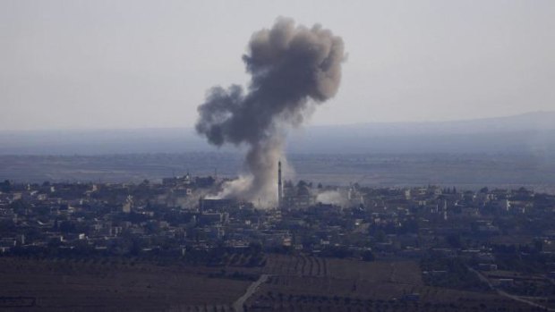 Smoke rises from the Syrian village of Jubata al-Khashab after it was bombed by a Syrian fighter jet. The jet was shot down by the Israeli military moments later.