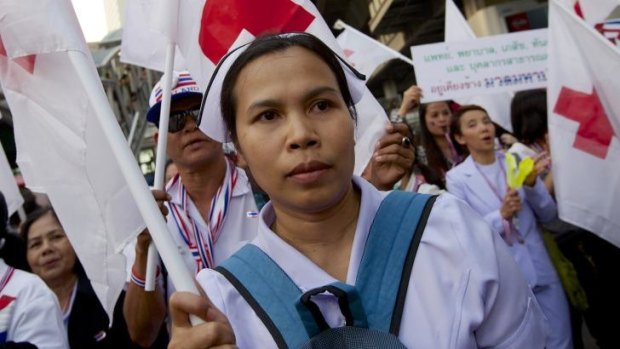 Thai nurses and doctors march in support of anti-government protestors.