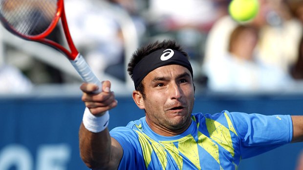 Marinko Matosevic returns a ball during the final of the Delray Beach International in Florida.