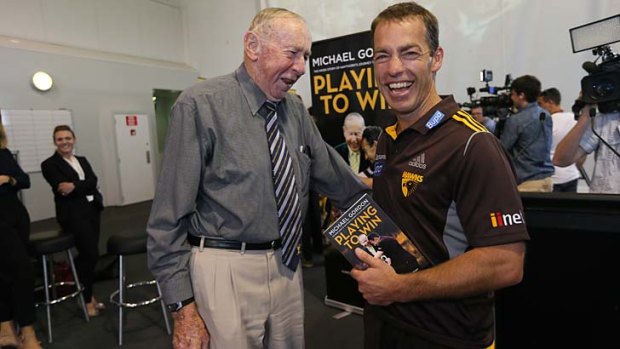 One for all: Alastair Clarkson with John Kennedy on Wednesday.