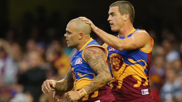 Ash McGrath, left, playing last year for Brisbane Lions.