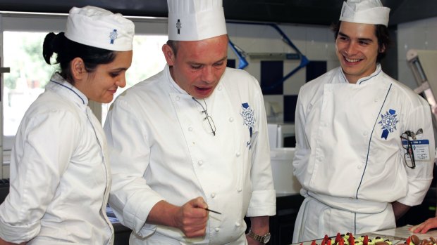 Icing on the cake: A chef tutors students in the finer points of presentation at Le Cordon Bleu International.