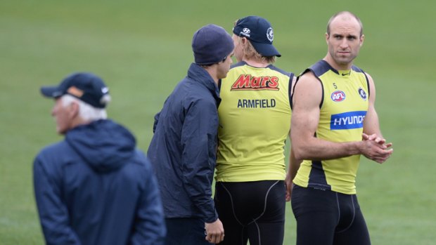 Steady hand: Carlton coach Mick Malthouse keeps an eye on the players, including Chris Judd (right), at training on Wednesday.