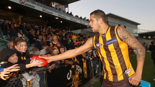 Lance Franklin celebrates with fans after the win over Gold Coast. The Hawthorn star is set to face the tribunal over an alleged striking incident.