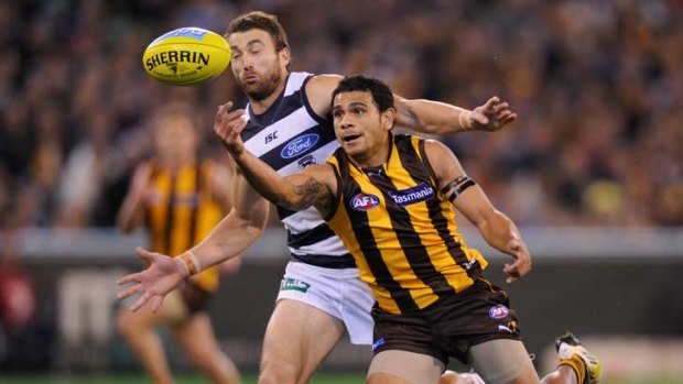 Cyril rioli battles Corey Enright.