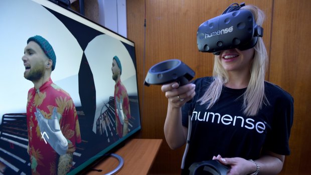 Co-founder Amber Cordeaux using Humense's human-to-human virtual reality software with a Vive headset.