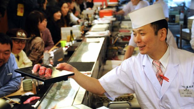 Busy early-morning Sushi Zanmai at Tokyo's Tsujiki fish market.