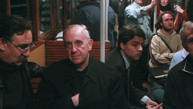 In this 2008 photo, the new Pope Jorge Mario Bergoglio, second from left, travels on public transport in Buenos Aires, Argentina.