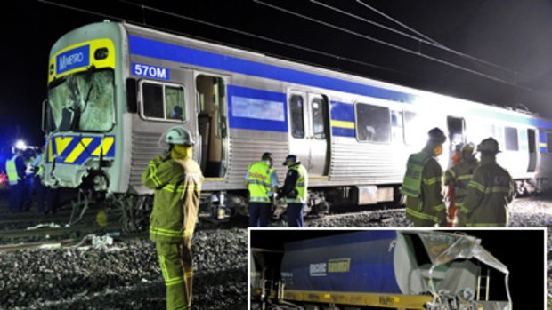 Emergency workers took 20 minutes to remove the injured passengers and driver from the Metro train after last night's collision with the freight train (inset).
